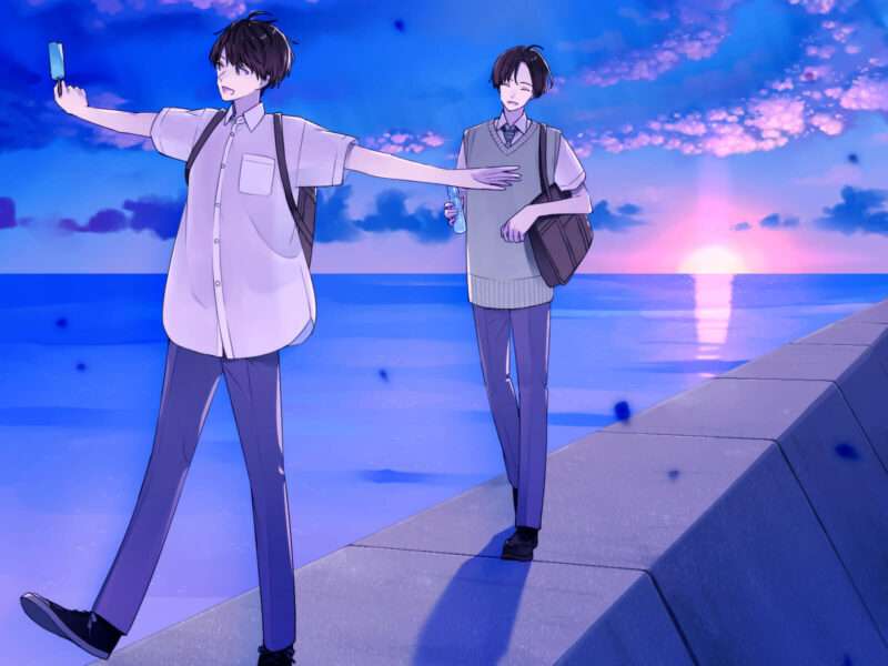 海岸を歩く2人の男子高校生